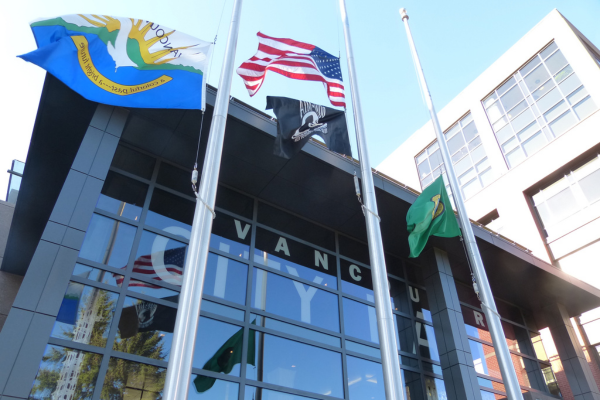 city hall front with flags