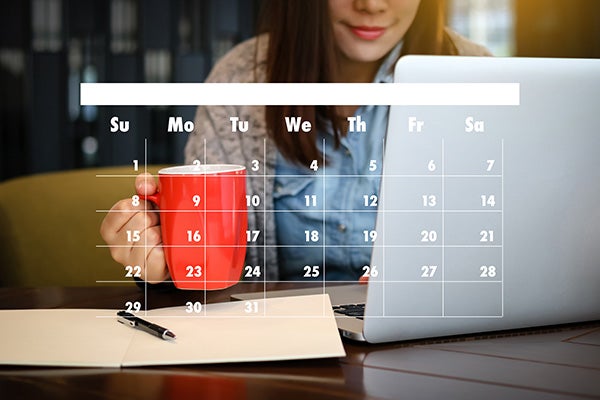 Woman looking at a Calendar