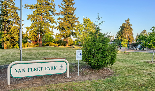 Van Fleet park sign with playground behind