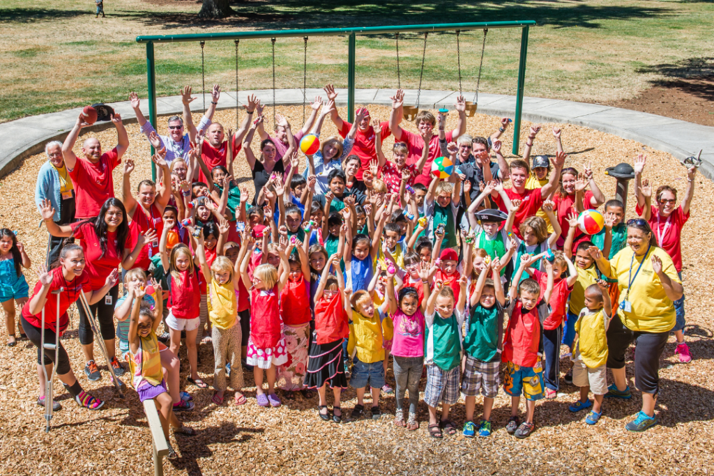 recreation counselors in group of youth at park