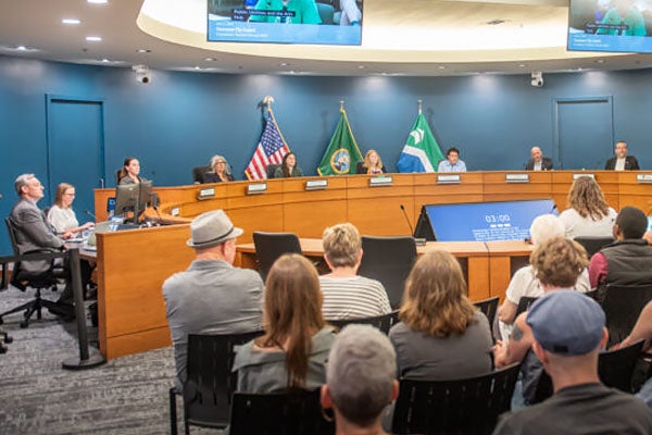 Council chambers full of councilors, city leadership and public