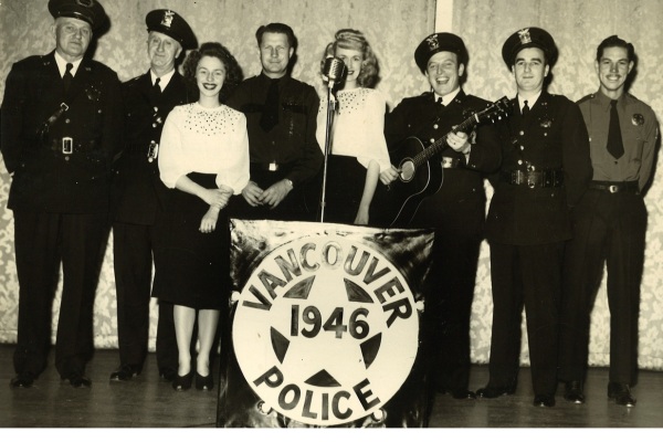 Black and white image of 1946 Vancouver Police group with guitar