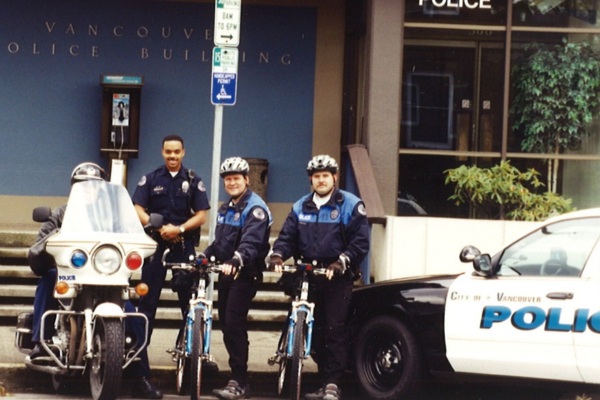 old color image of police on bikes from 1985-2000