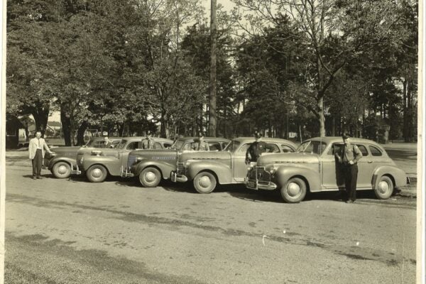 Old time Police officers with 1950s cars