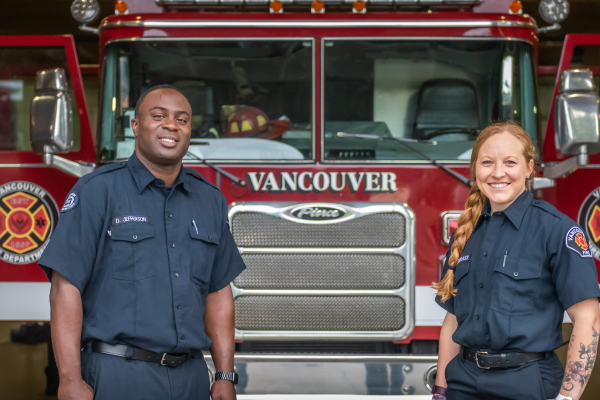 Two firefighters with fire truck