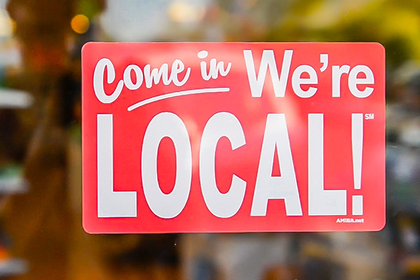 sign on business door "come in we're local"