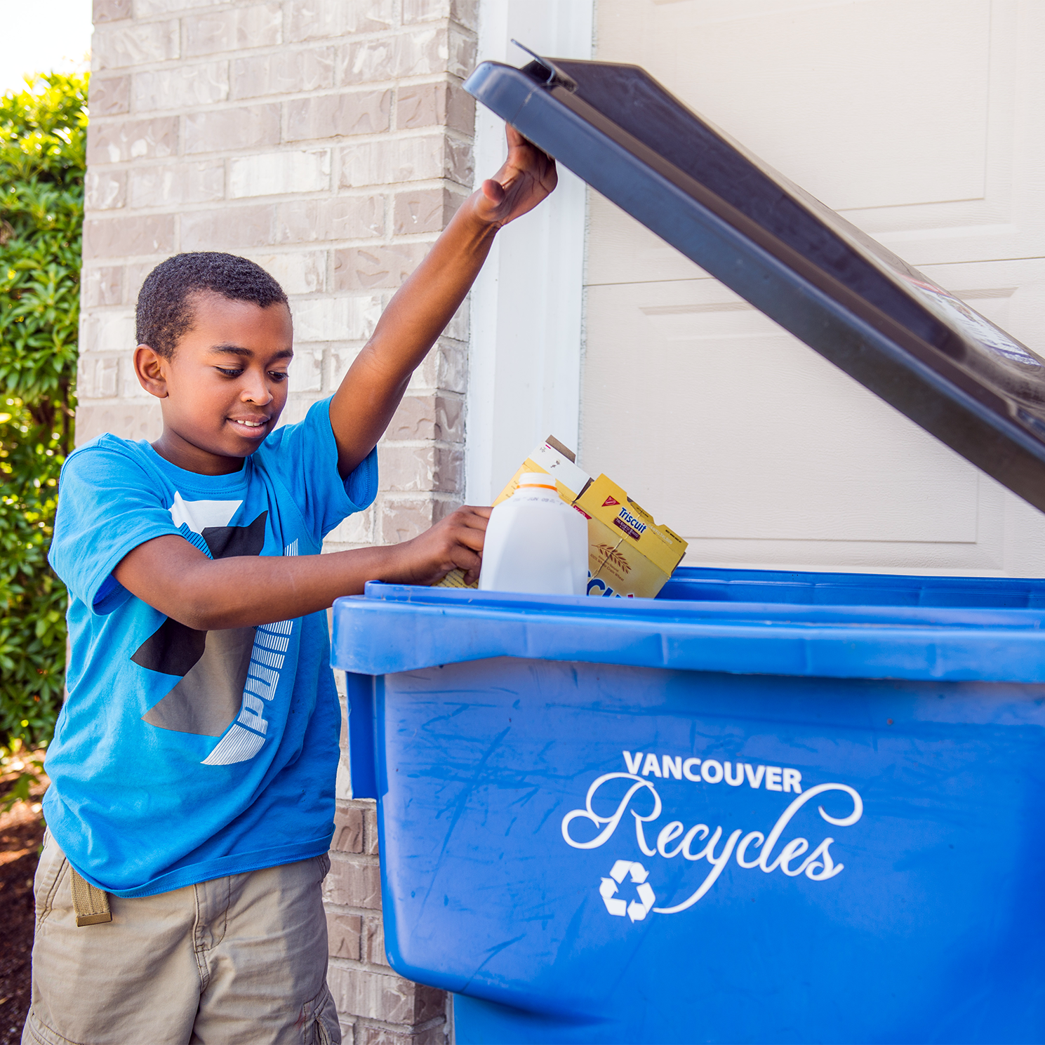 Tossing items into and recycle cart and recycling properly