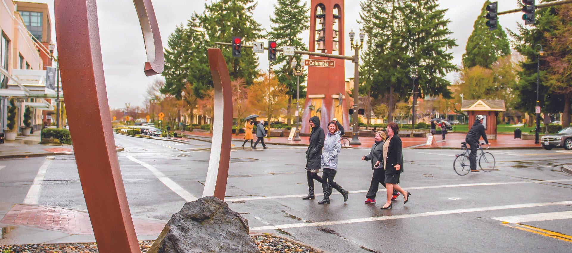 people walking, biking and driving downtown