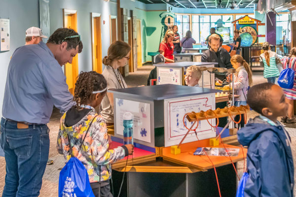 Community members exploring the Water Center's exhibit floor