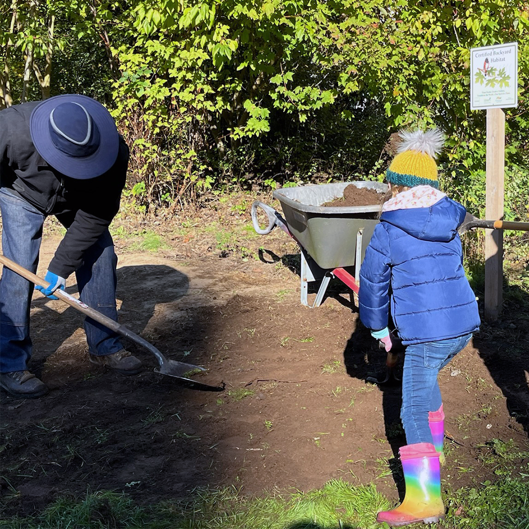 Volunteers cleaning up the garden
