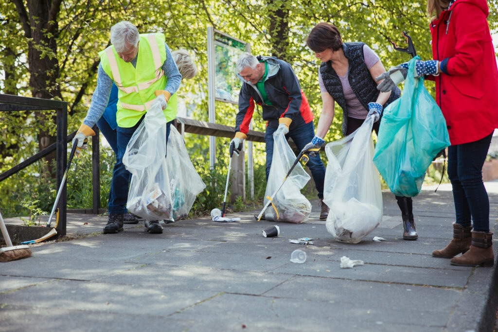 Group of volunteers picking up litter