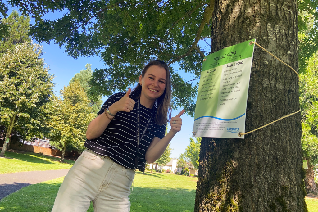 Woman learns about tree species at pop-up arboretum