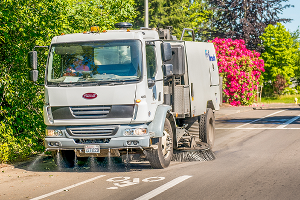 street sweeping along local road with bike lane