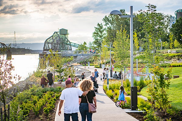 Waterfront trail with people walking along Columbia River