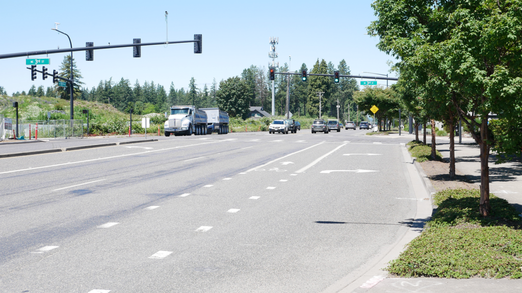 View of 192nd Avenue to the north with trucks and cars traveling near the NE 3rd Street intersection
