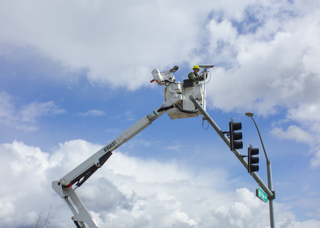 Jeff in a bucket truck working on signal infrastructure above Mill Plain Boulevard