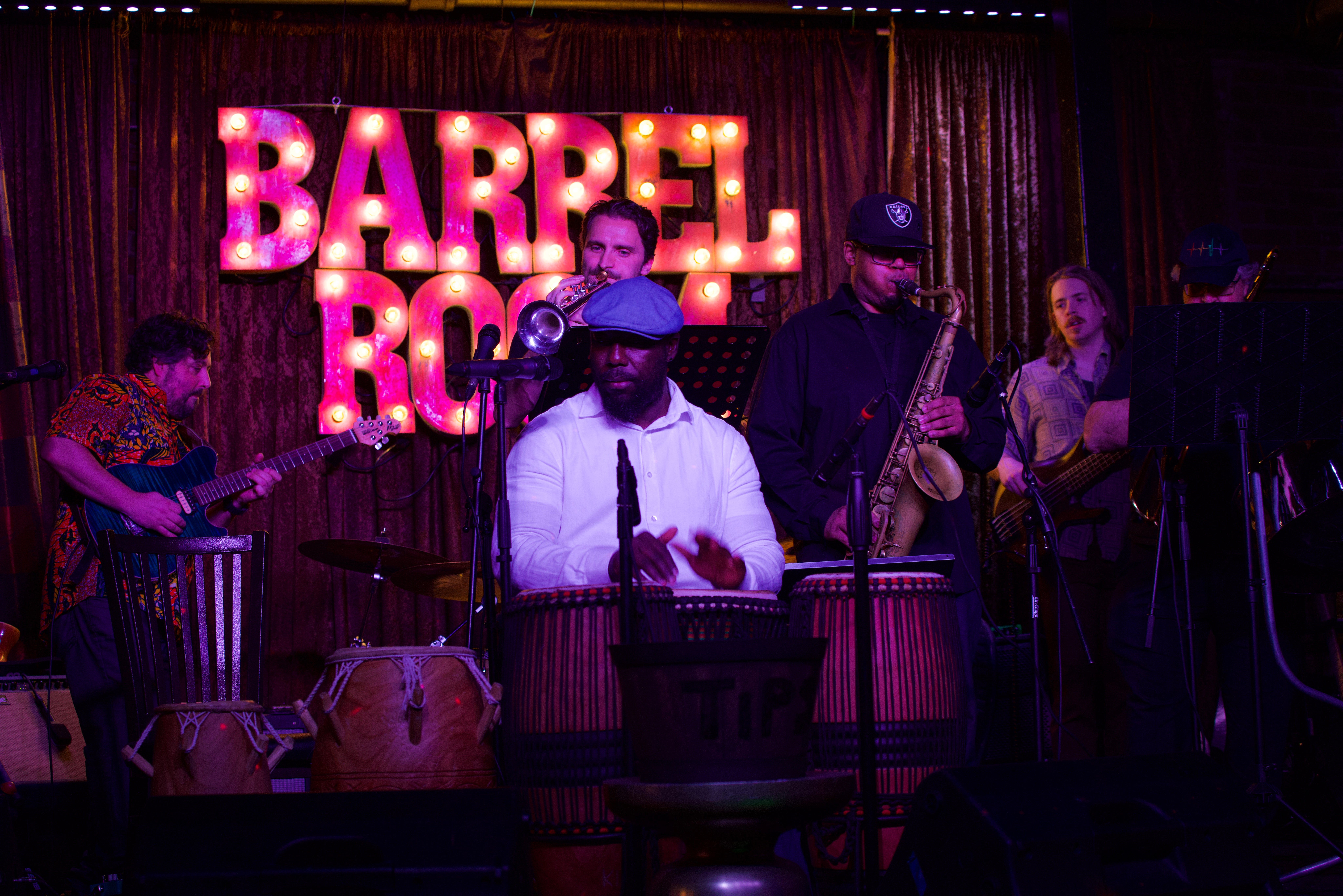 The Afrobeat band, Wamba, plays on a stage.