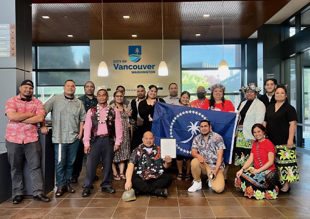 Chuukese Heritage and Unity Day - community members accepting proclamation at City Hall lobby