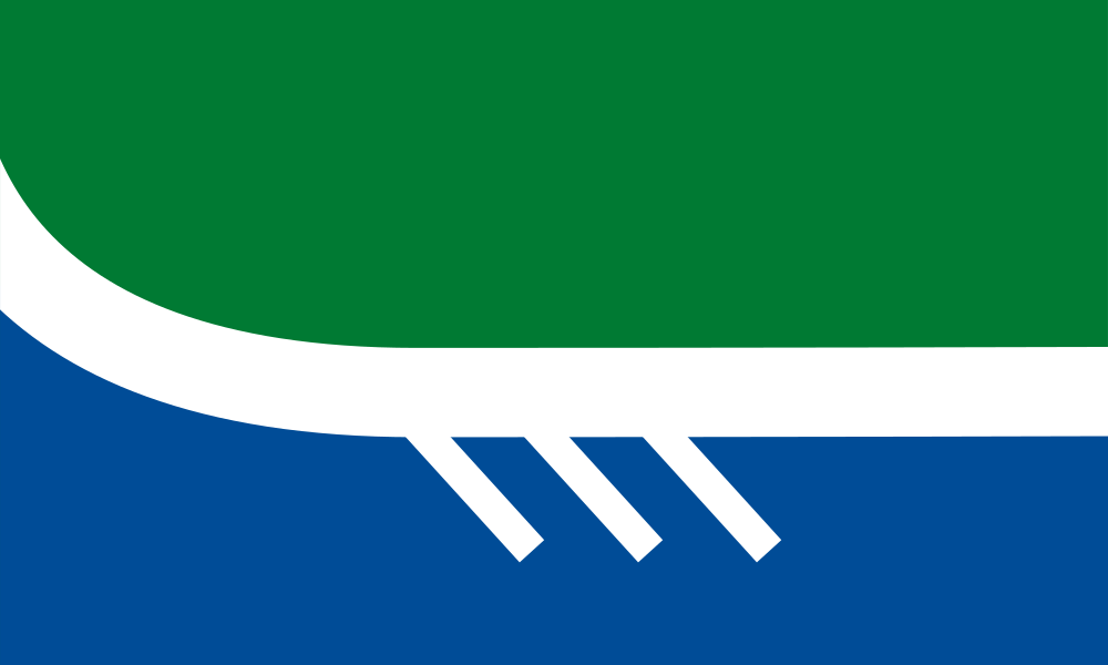Flag shows green top, white curved line with extending lines representative of canoe paddles, blue bottom