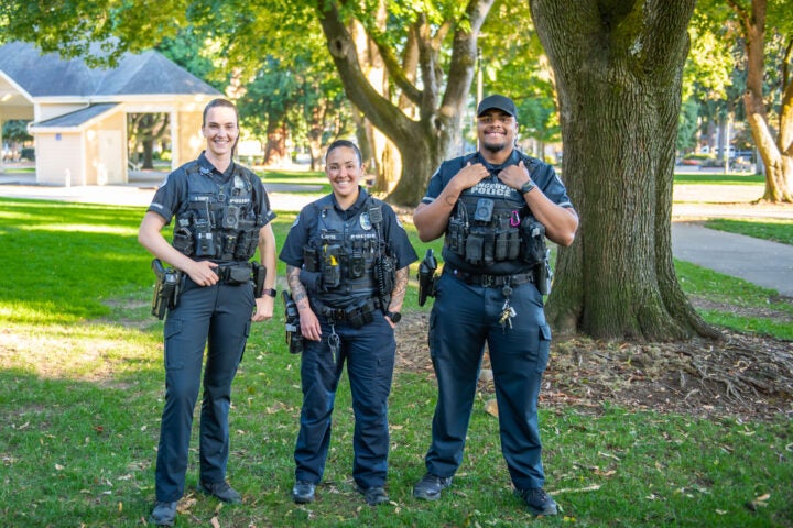 Three vancouver officers in a park