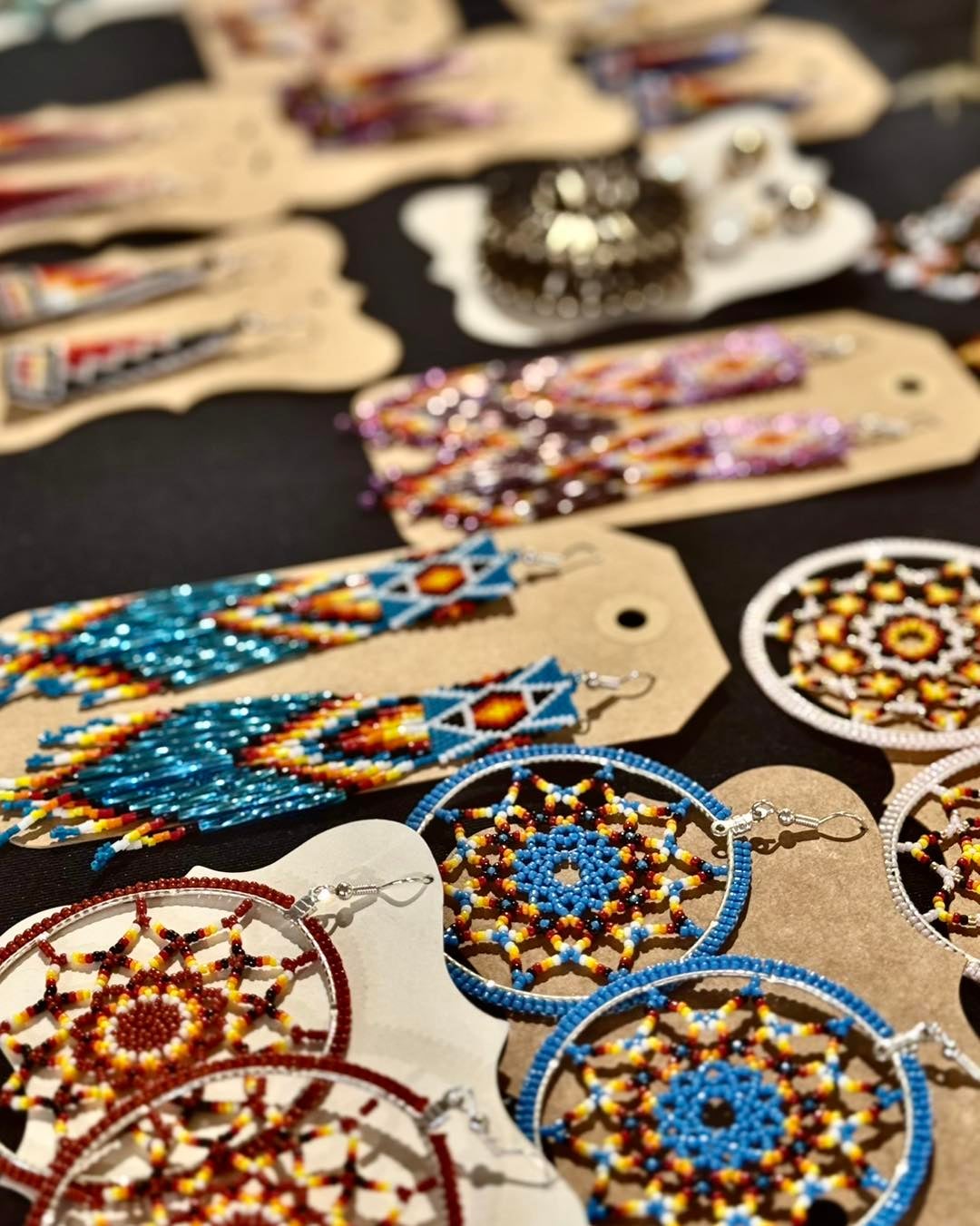 Indigenous beaded earrings displayed at a market