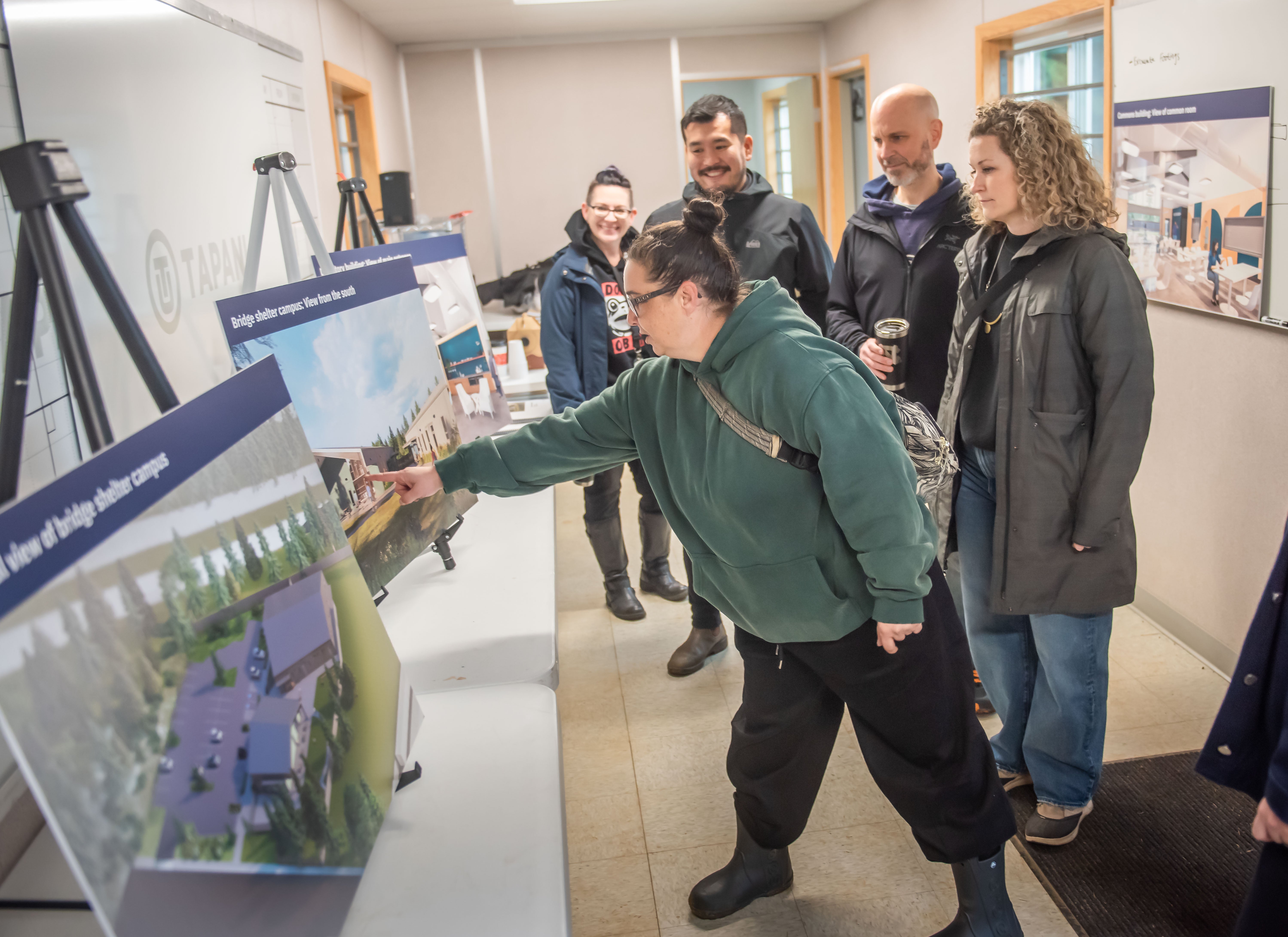 Jamie Spinelli, City Homeless Response Manager, talks about the Bridge Shelter design renderings with City Councilor Ty Stober, site architect and Shannon Troy, Do Good Multnomah.