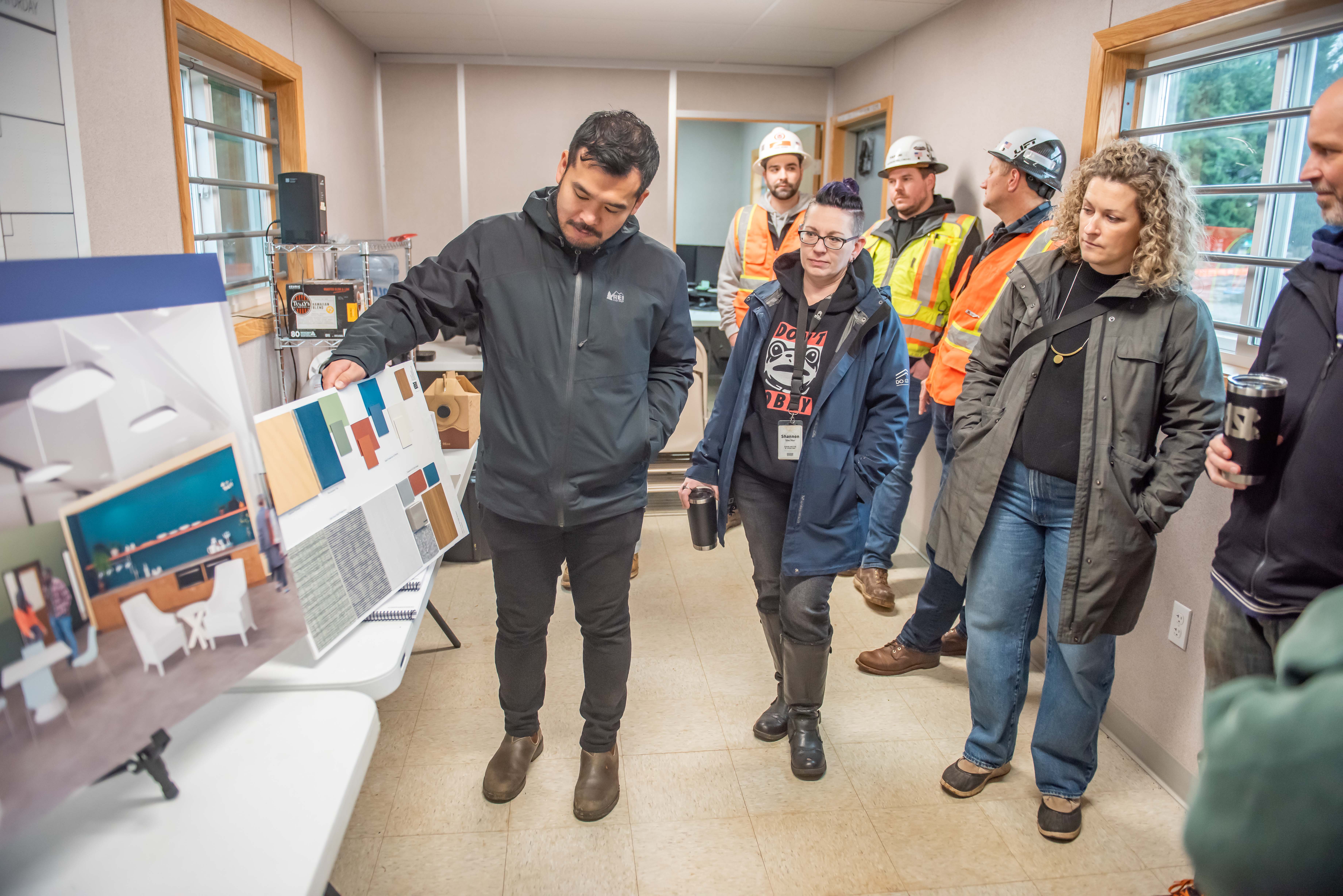 Scott Edwards Architecture discusses sit finish samples with City Councilor Ty Stober and Shannon Troy from Do Good Multnomah.