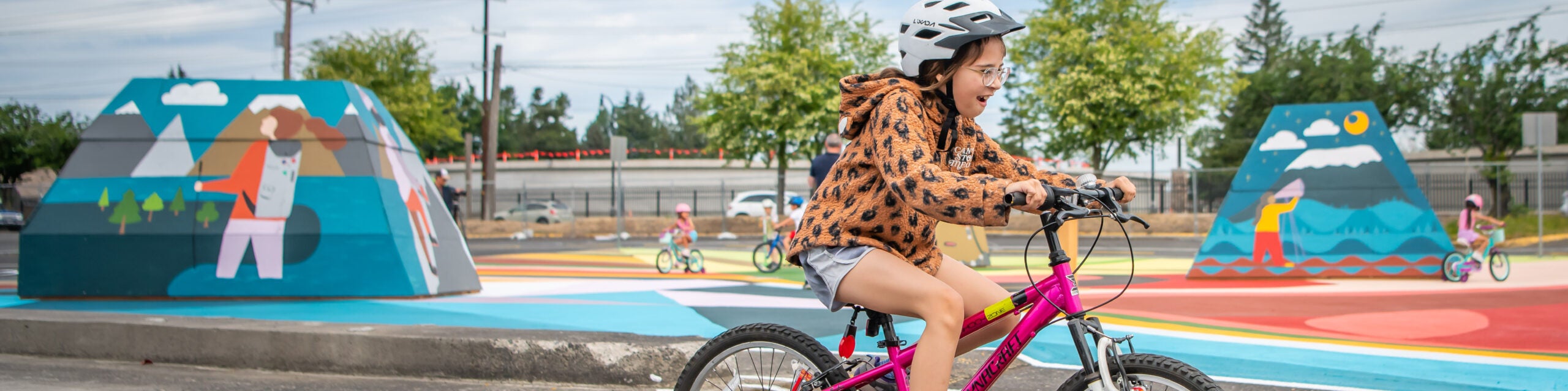 Kid riding bicycle at the heights bike garden.