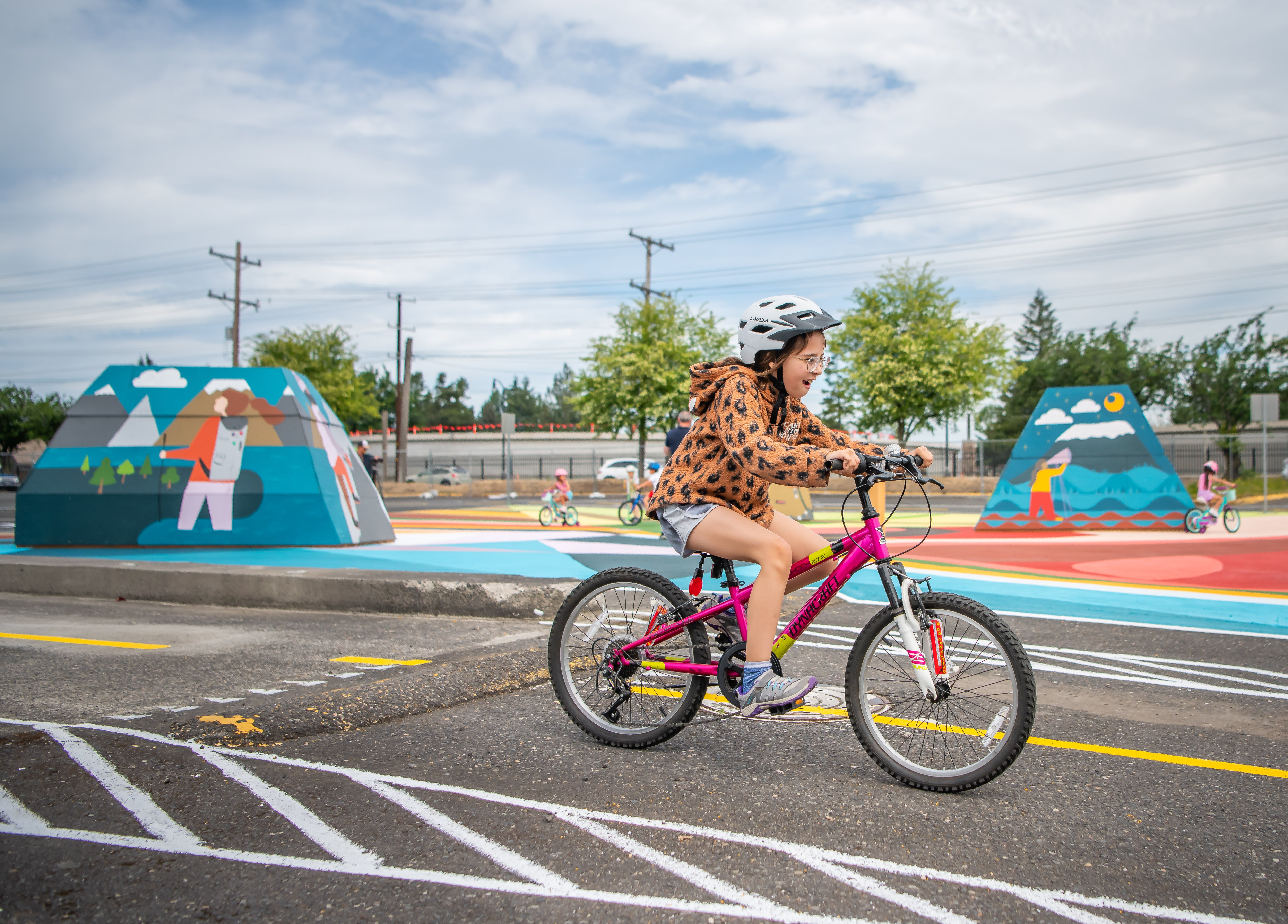 Kid riding bicycle at the heights bike garden.