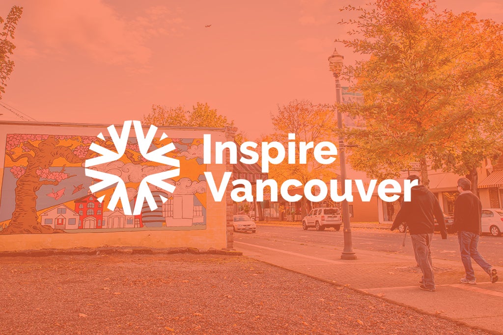 Mural featuring cherry blossoms and paper cranes with an orange color overlay and white Inspire Vancouver logo