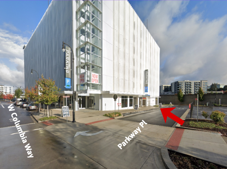 Google maps street view of the entrance of the Waterfront Vancouver Parking Center, a red arrow indicating the entry point on Parkway Place.