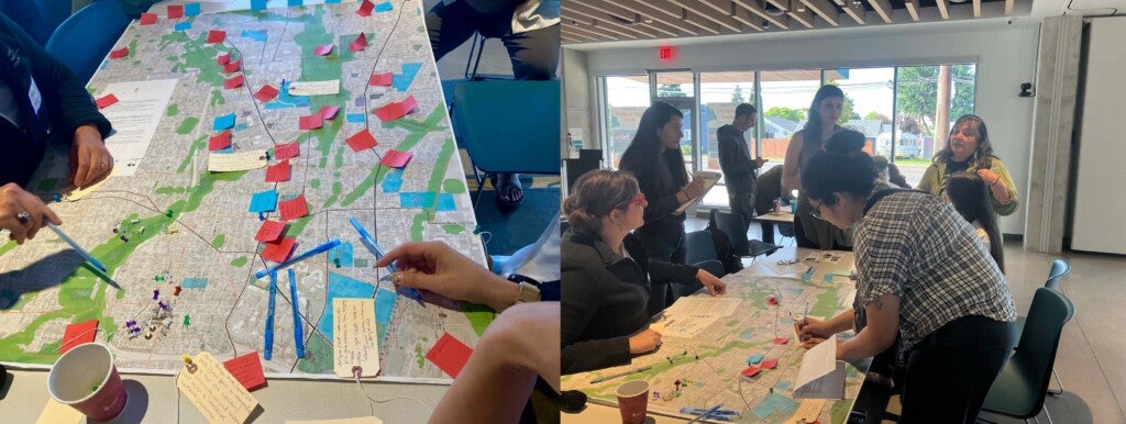 Community input session with community members and City staff interacting over a map with post it notes and push pins.