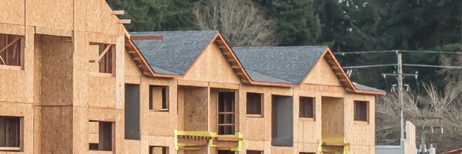 Apartments under construction during the framing and roofing phase