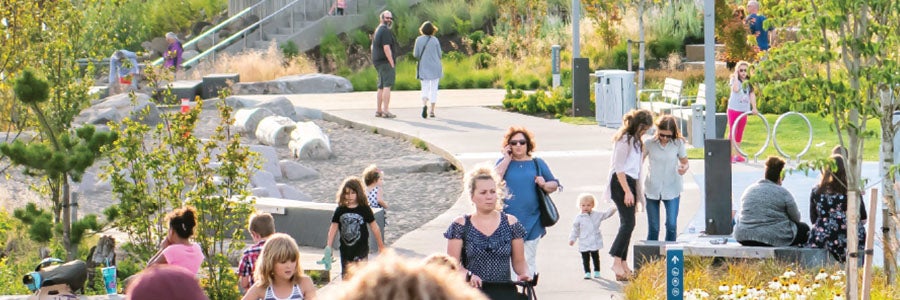 Busy Waterfront pathway on clear day