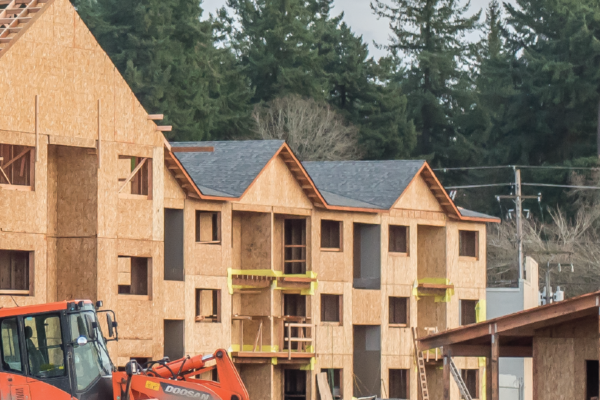 Apartments under construction during the framing and roofing phase